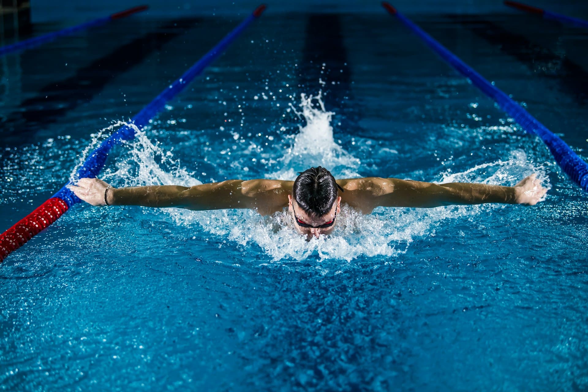 A swimmer training in a public lap pool